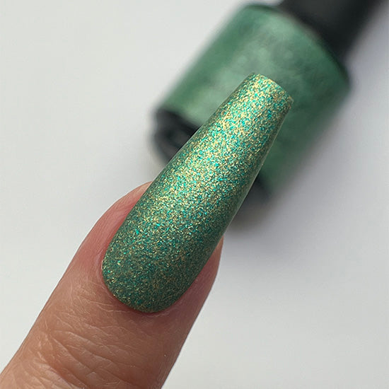 Madam Glam Shamrock Glow nail polish bottle with vibrant green nail polish and shiny finish on white background