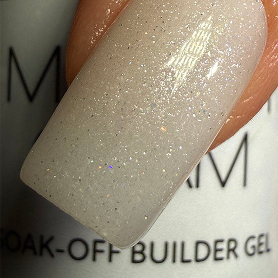 Sheer white nail polish by Madam Glam shown in a clear bottle with a white cap, glossy finish, and smooth liquid texture.