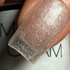 Madam Glam Shimmer Clear nail polish bottle with a shimmering, transparent finish and glossy cap.