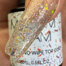 Madam Glam Sparkle On nail polish bottle with sparkly, glittery nail polish swatch showing a shimmering, glamorous finish.