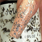 Madam Glam Touches of Silver nail polish bottle with silver shimmer finish and sleek black cap.