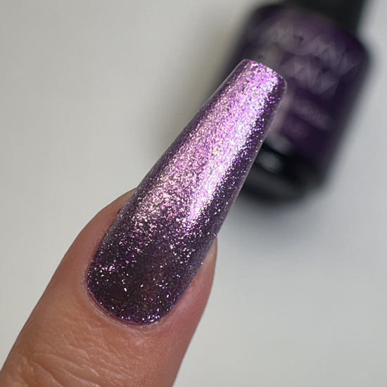 Madam Glam Twilight Tints nail polish bottles with vibrant, shimmering colors displayed on a white background