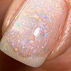 White Mermaid nail polish by Madam Glam in a sleek, glossy bottle with a white cap and clear label, showcasing the product.