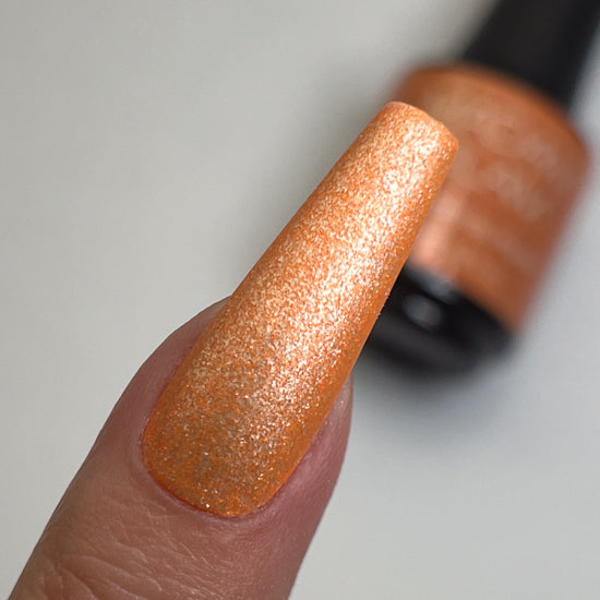 Madam Glam Wicked Whisper nail polish bottle with black cap and clear label showing the shade name.