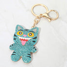Bling studded Kpop Demon Hunters Derpy keychain bag charm with colorful embellishments, attached to a bag or wallet.