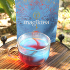 Magiktea Palo Azul tea bags, 15 plant-based USDA organic tea bags with fresh Palo Azul herbs in a natural setting.