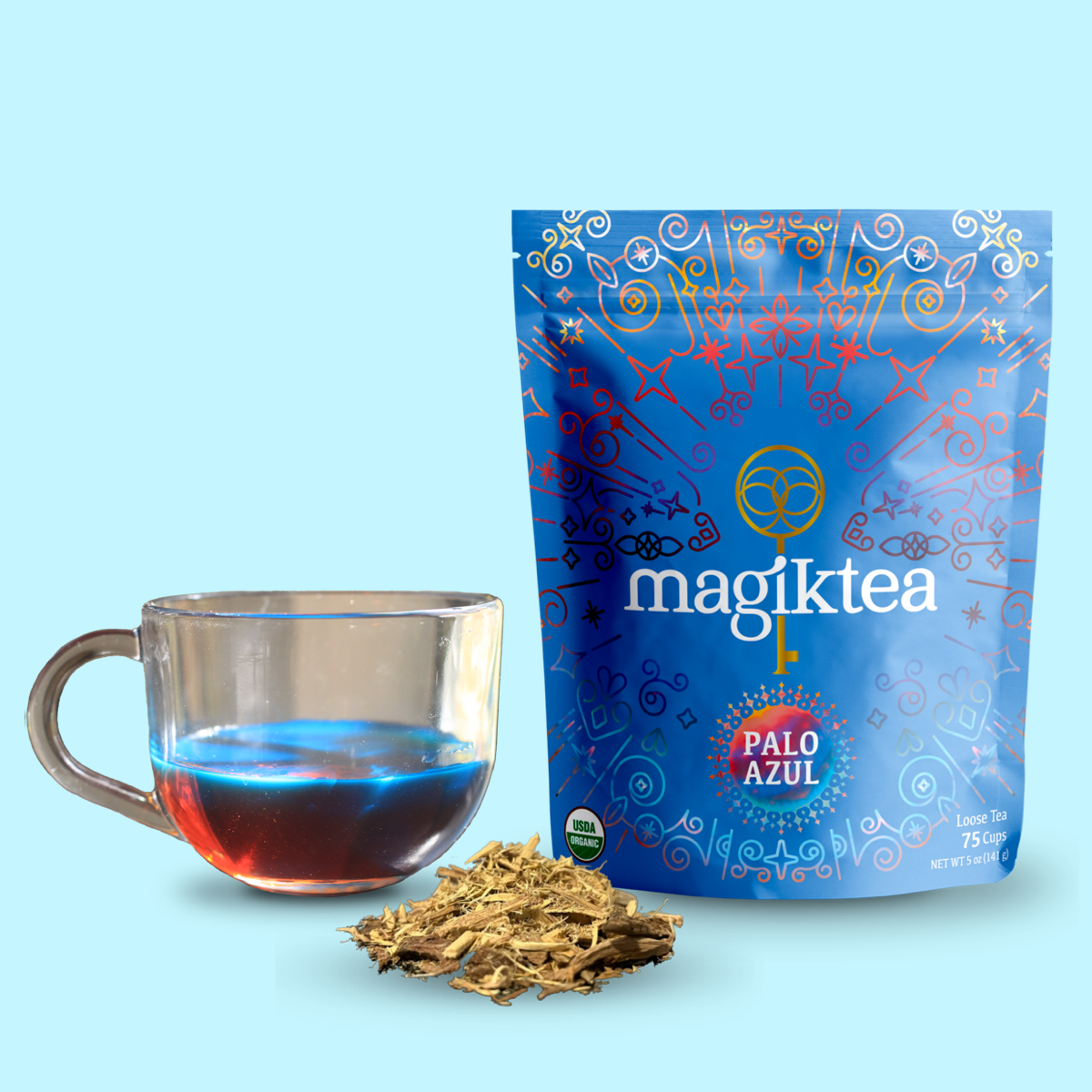 Loose Palo Azul tea from Magiktea in a 5 oz package, USDA Organic, displayed in a clear tea cup showing its blue hue.