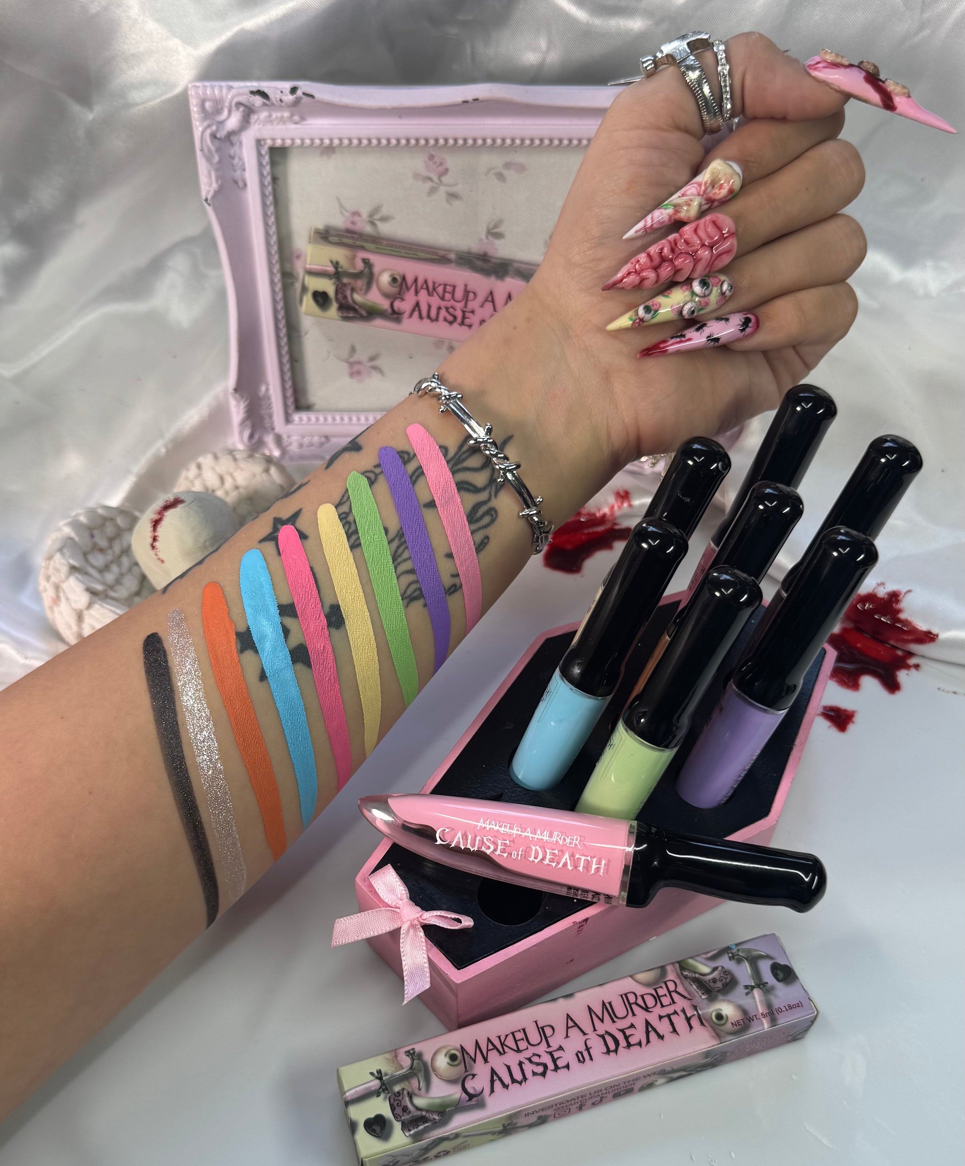 Makeup A Murder, INC Cause of Death Pastel Collection featuring pastel makeup shades in sleek packaging.
