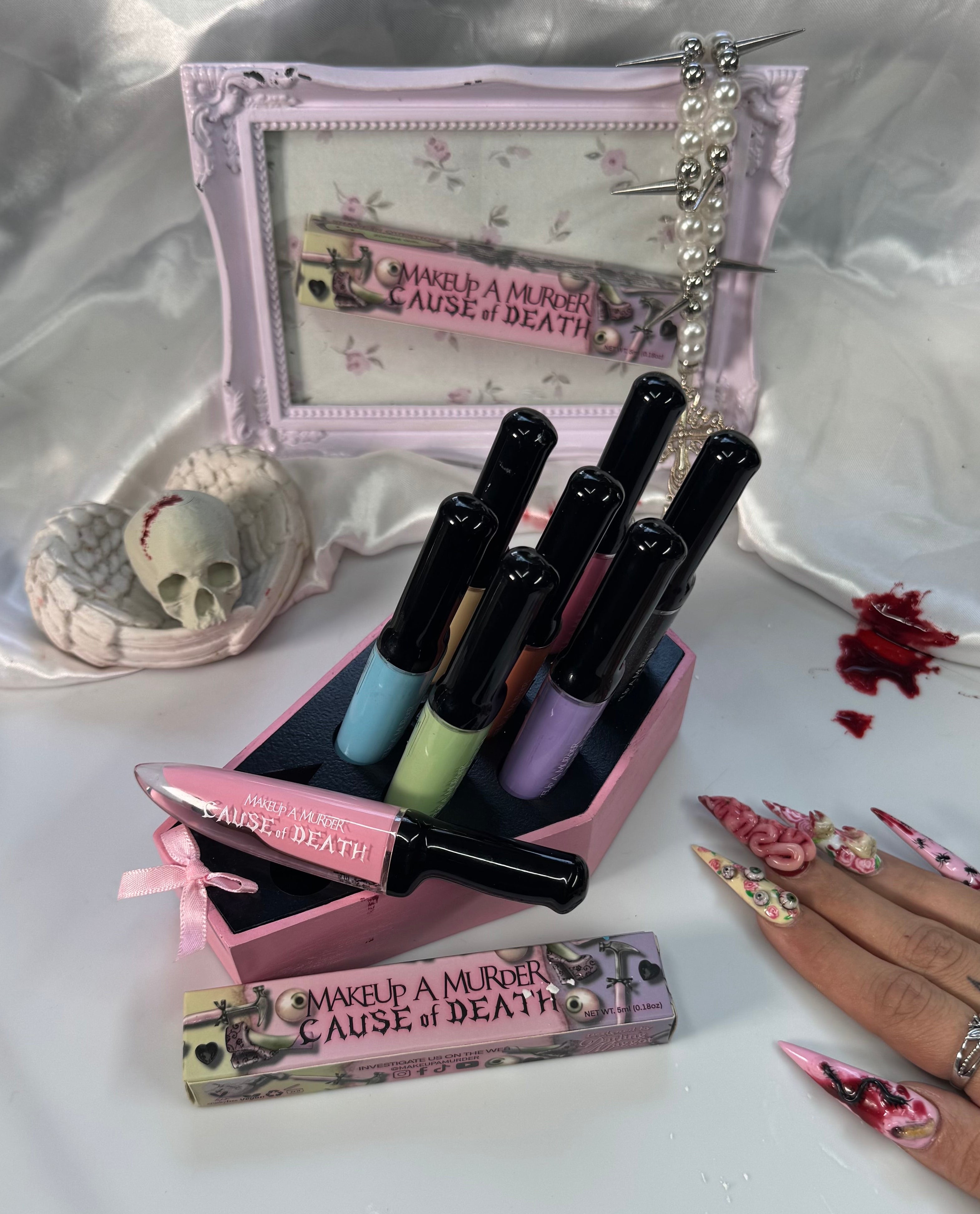 Makeup A Murder, INC Cause of Death Pastel Collection featuring pastel makeup shades in sleek packaging.