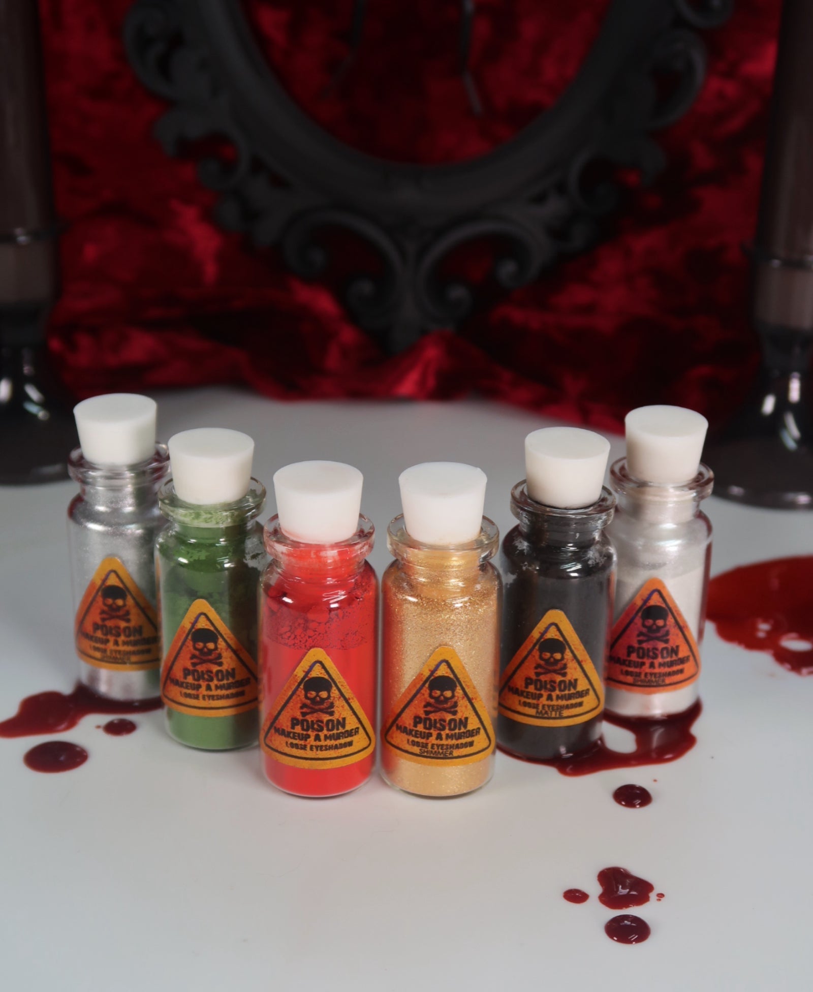 Holiday Poison pigment collection by Makeup A Murder, INC featuring vibrant, colorful eyeshadows in various shades and finishes.