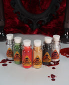 Holiday Poison pigment collection by Makeup A Murder, INC featuring vibrant, colorful eyeshadows in various shades and finishes.