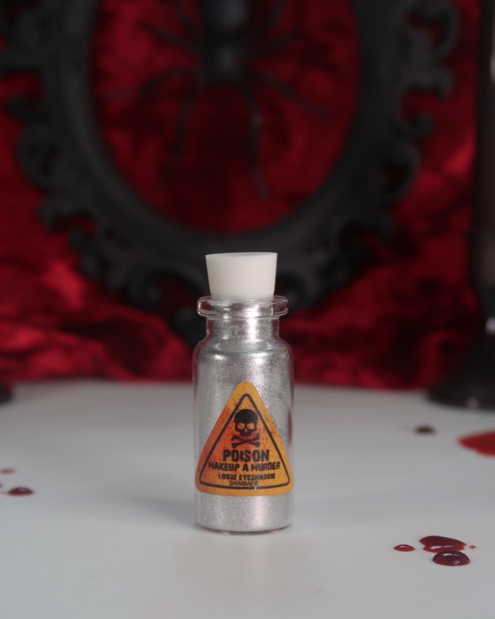 Makeup A Murder, INC Holiday Poison Pigment Collection with colorful eyeshadows and pigments in festive packaging.