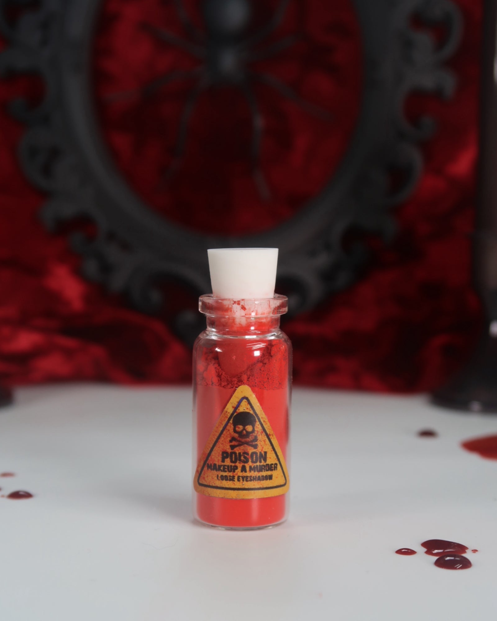 Makeup A Murder, INC Holiday Poison Pigment Collection with vibrant, colorful makeup pigments in festive packaging.