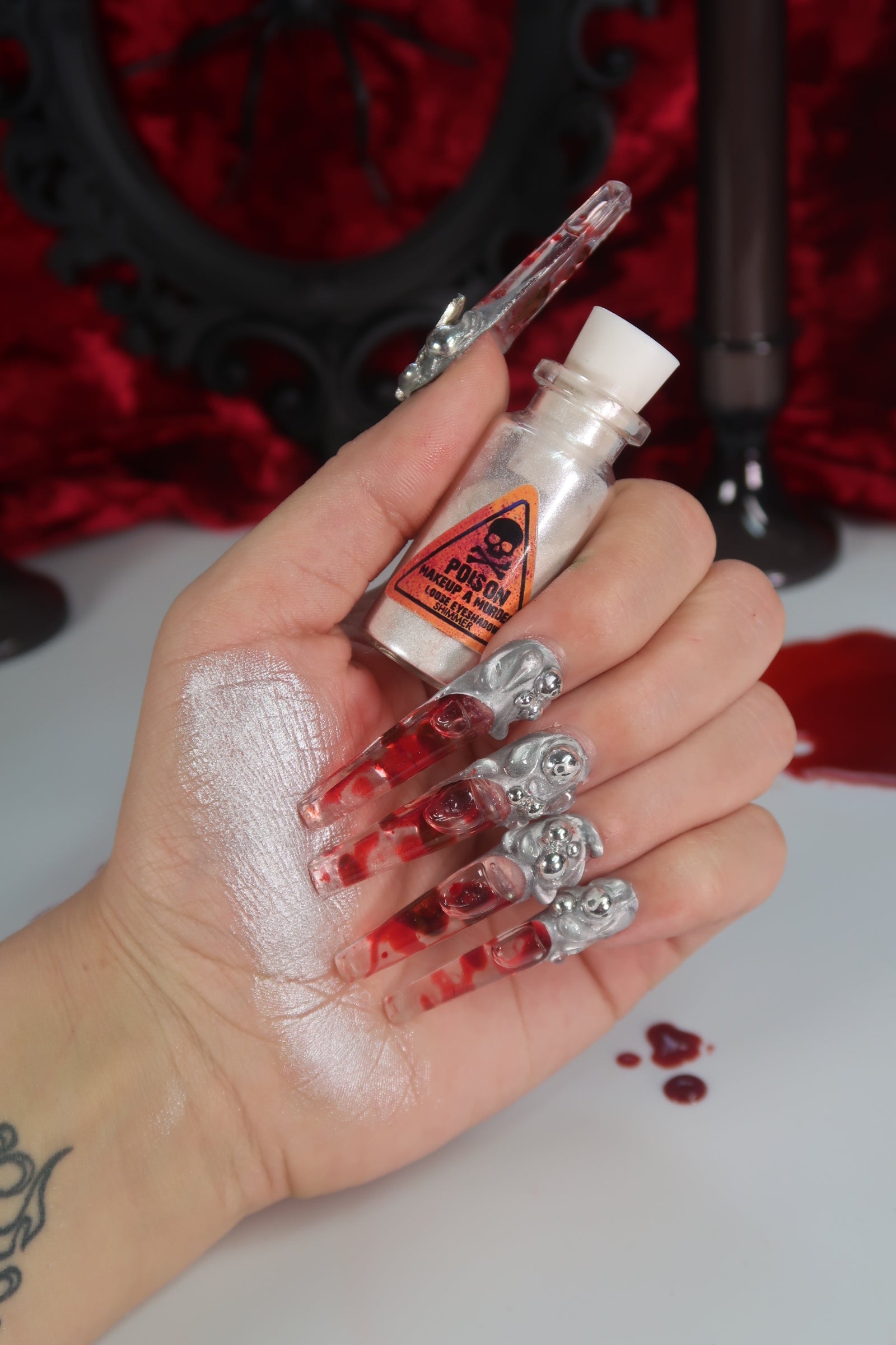 Makeup A Murder, INC Holiday Poison Pigment Collection with vibrant, colorful makeup pigments in various shades.