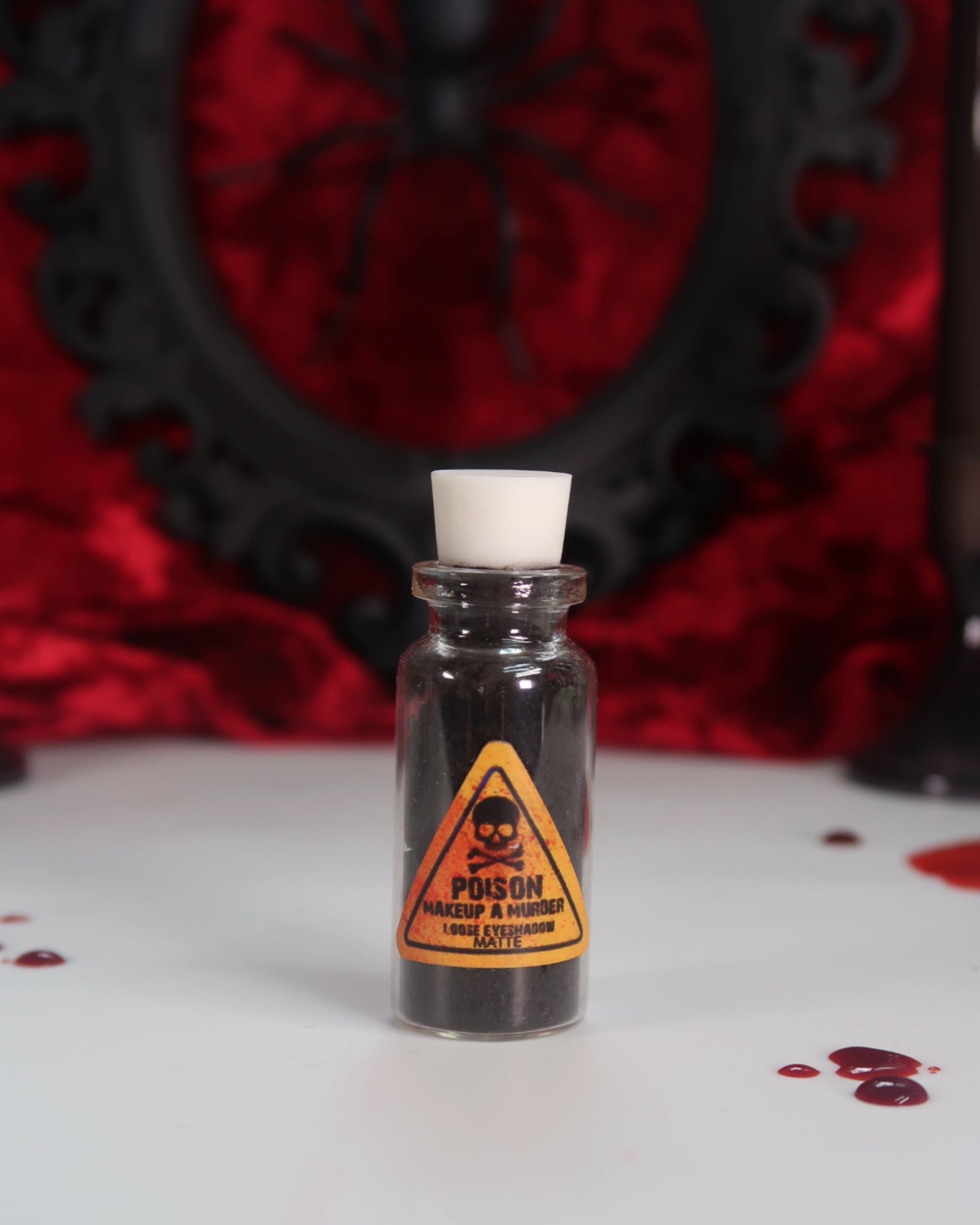Makeup A Murder, INC Holiday Poison Pigment Collection with vibrant, colorful makeup pigments in various shades.