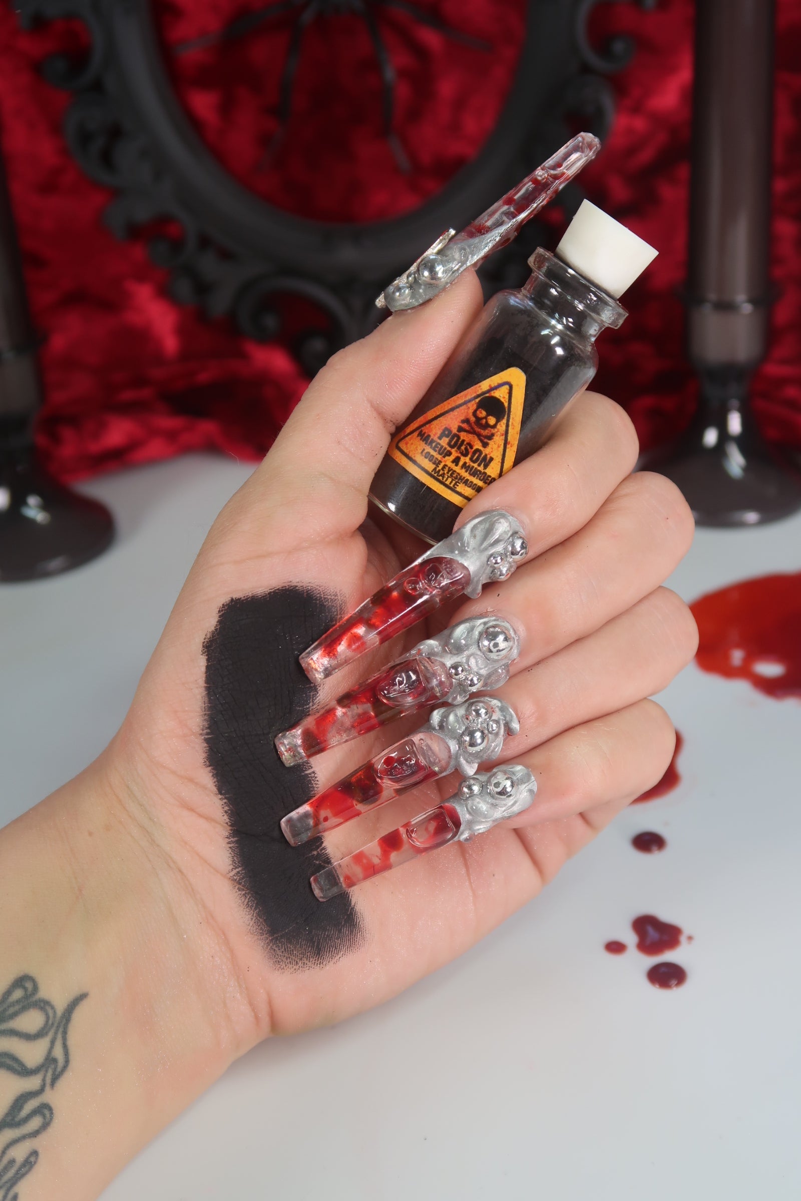 Makeup A Murder, INC Holiday Poison Pigment Collection with vibrant eyeshadow pigments in colorful packaging.