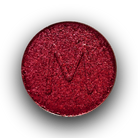 Eyeshadow lineup featuring Makeup A Murder, INC's Bloodshed Eye Shadow palette with vibrant and dark shades displayed.