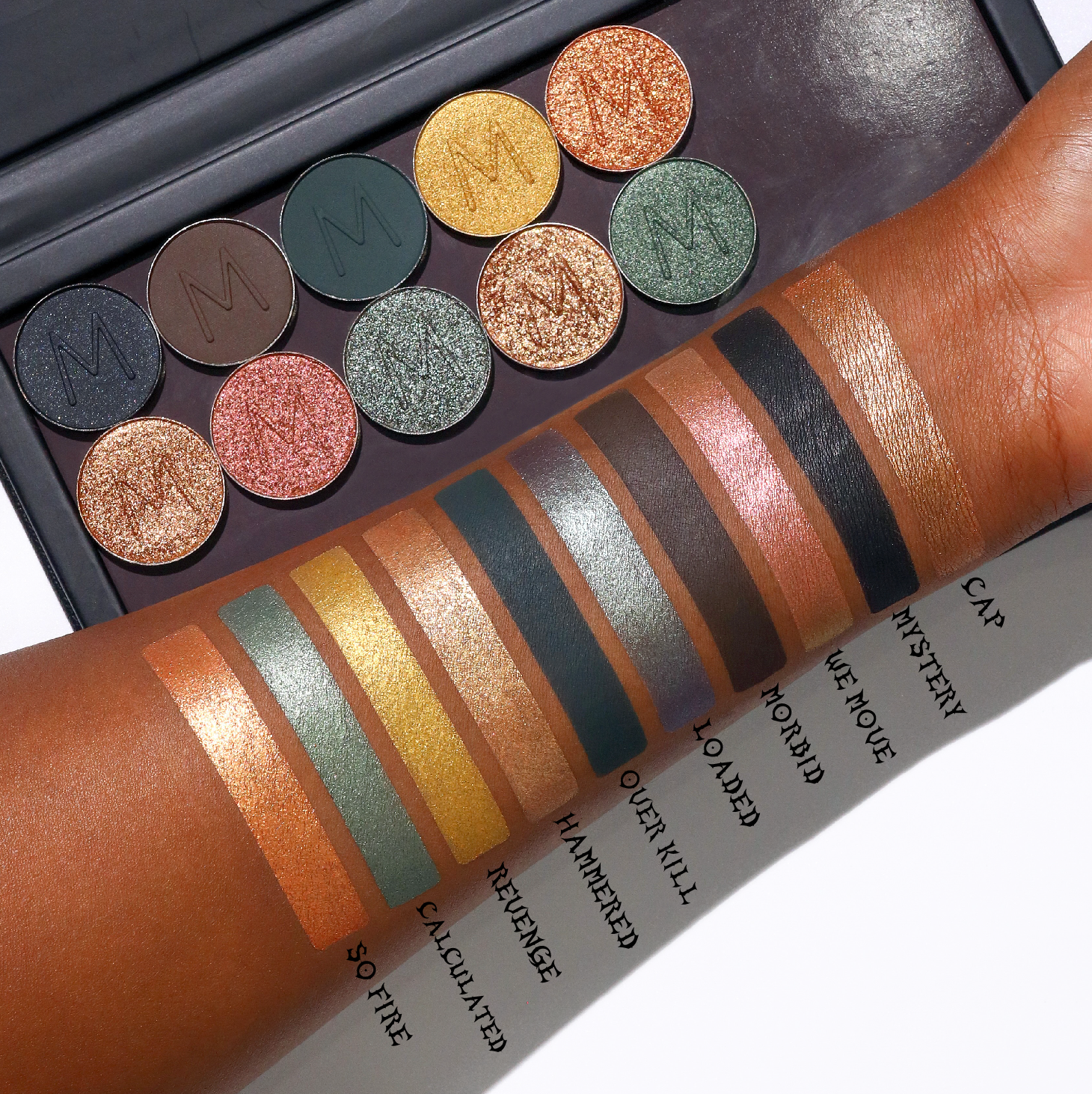 Makeup A Murder, INC blood-red eyeshadow lineup with various shades of eye shadow in sleek packaging.
