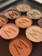 Makeup A Murder INC Bloodshed eyeshadow lineup featuring a palette of vibrant and bold eye shadow shades.