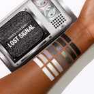Makeup A Murder, INC Lost Signal Eyeshadow Palette with vibrant and neutral shades in a sleek rectangular case.