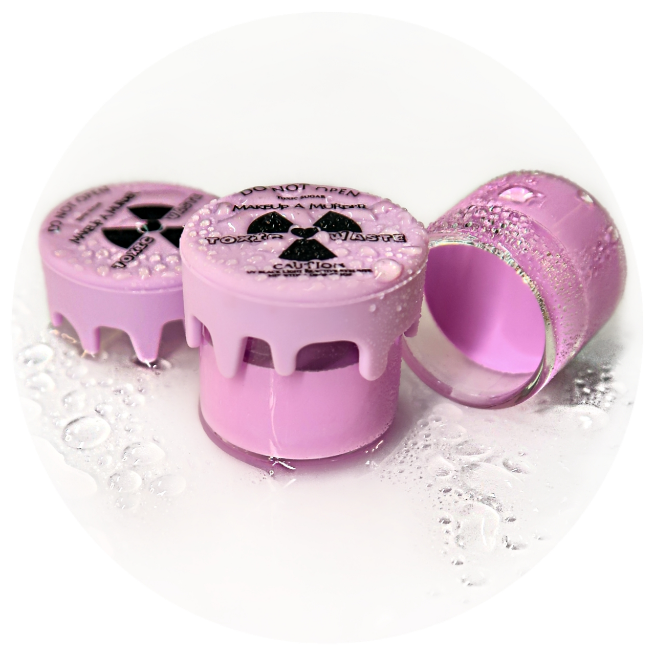 Makeup A Murder, INC Toxic Waste Neon Eyeliner Collection with vibrant, colorful eyeliners displayed on a sleek black background.