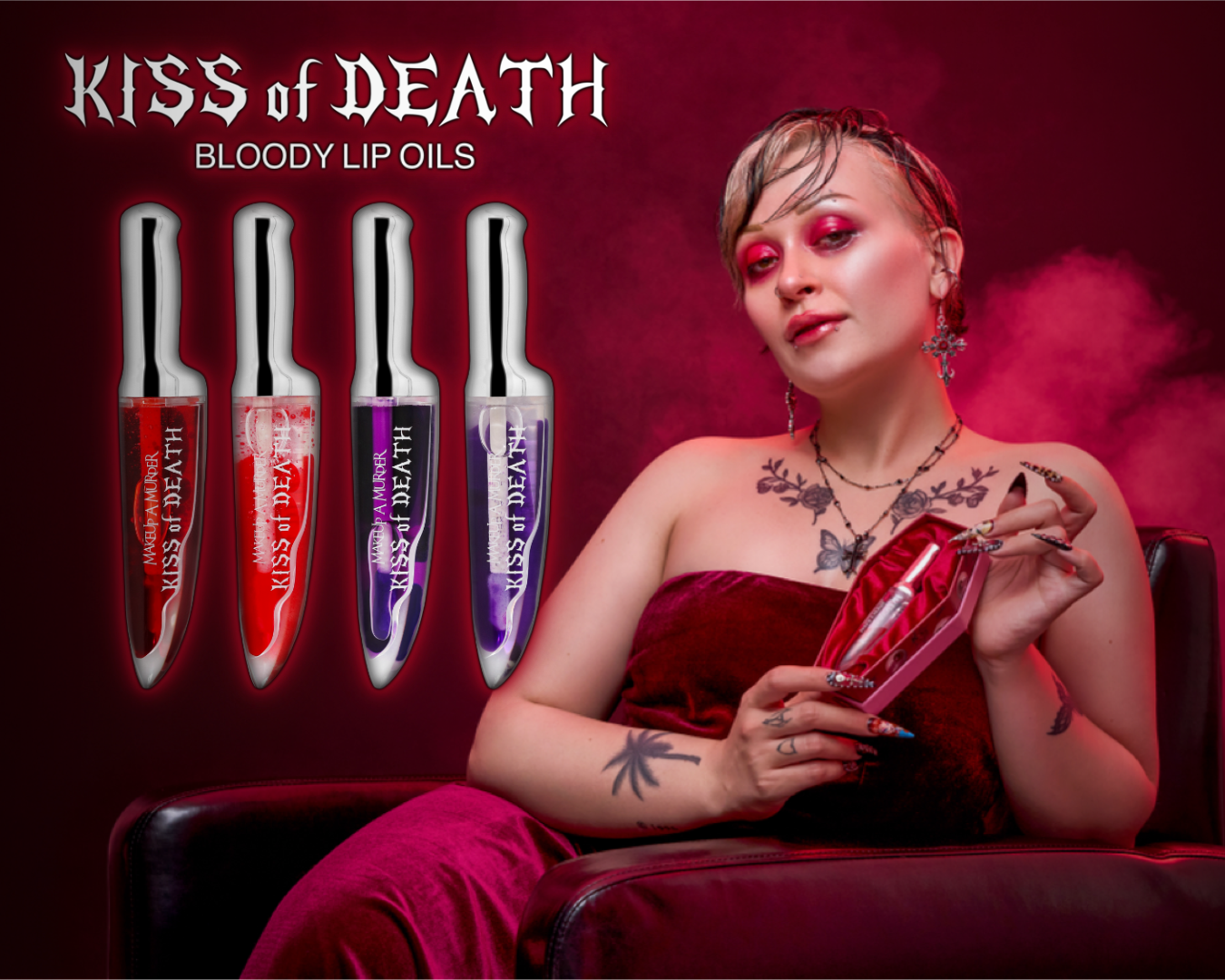 Makeup A Murder, INC KISS of DEATH Bloody Lip Oil lip gloss with a deep red, glossy finish, in a sleek tube.