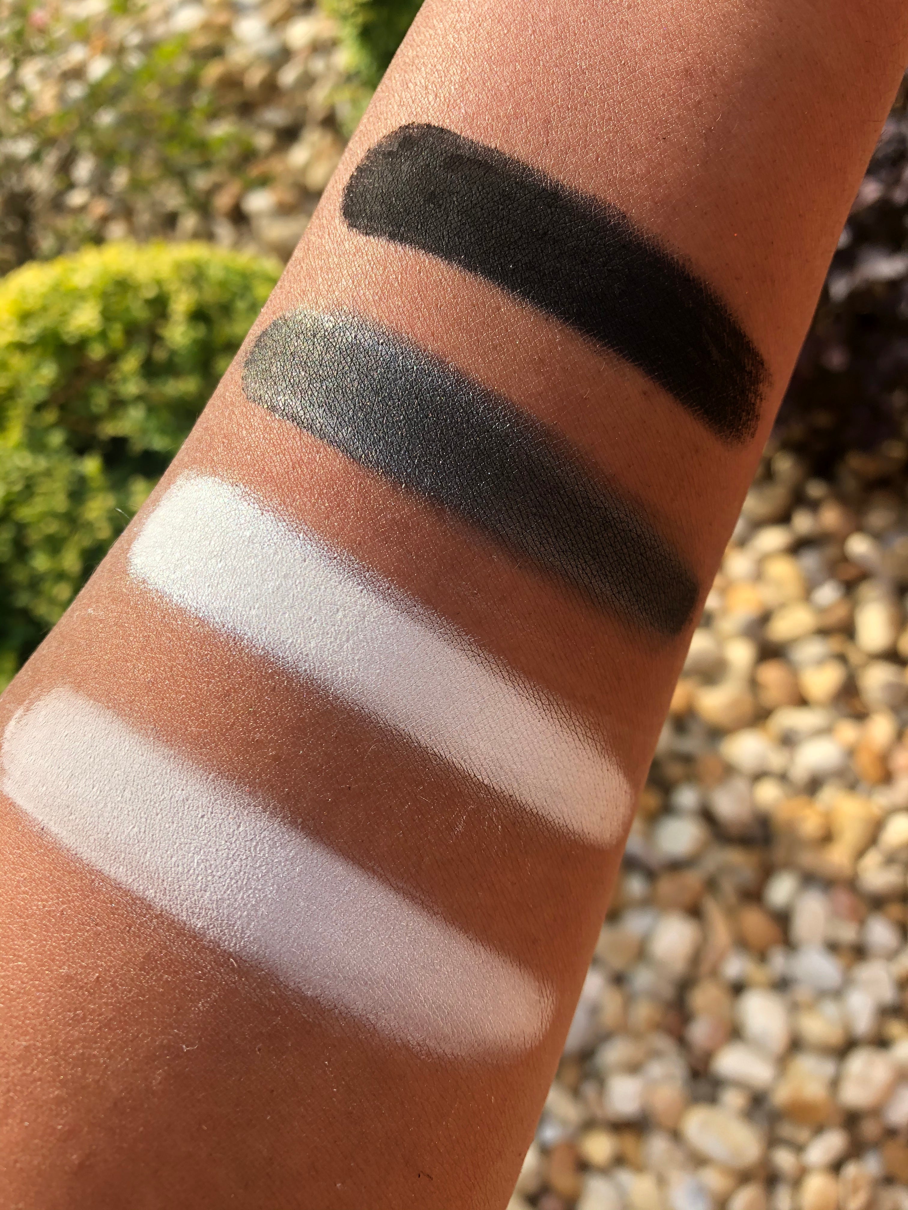 Makeup A Murder, INC Poison Pigment Collection master with Shimmer Mustard Gas pigment in a vibrant makeup palette.