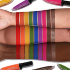 Makeup A Murder, INC rainbow liquid eyeshadow collection with vibrant shades in a red coffin-shaped palette.