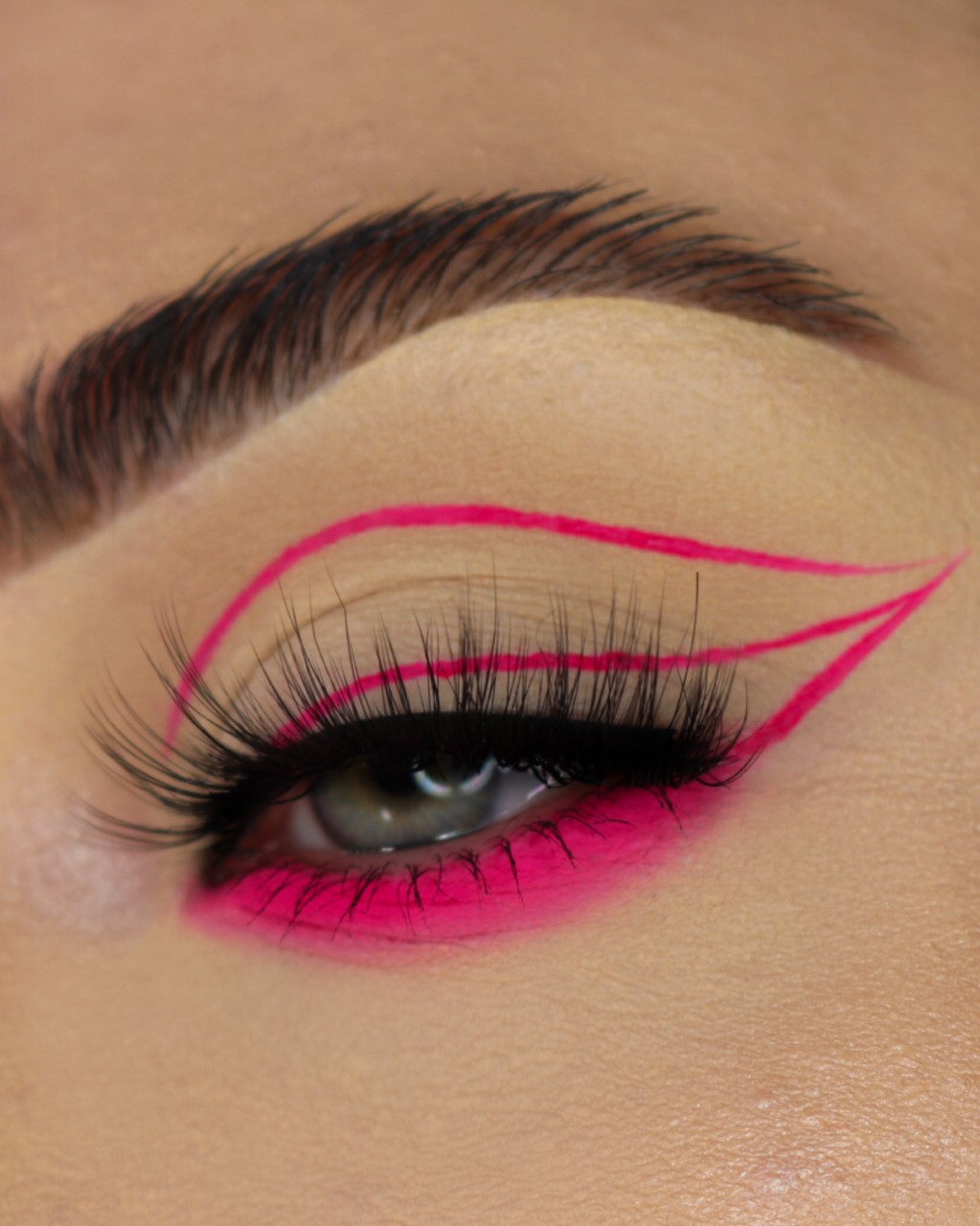 Neon pigments from Makeup A Murder, INC mixed with Chemical X Cosmetic Sealant, showing vibrant, glowing color in a cosmetic application.