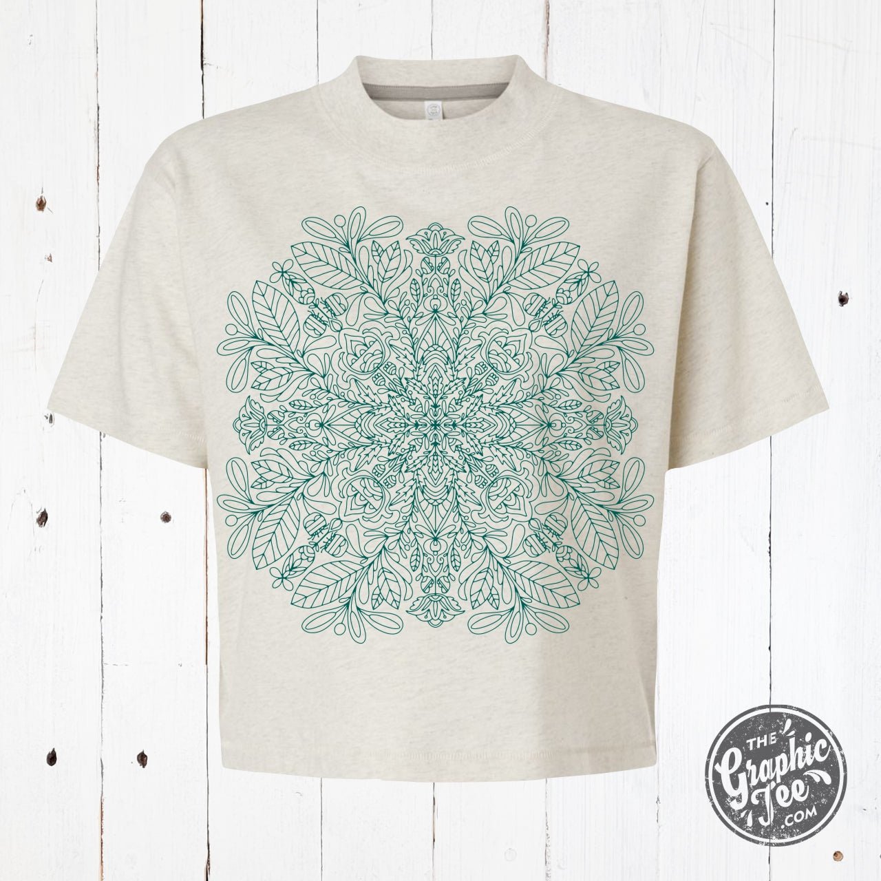 Mandala mid-length crop drop sleeve short sleeve tee by The Graphic Tee, featuring a colorful mandala design on a casual shirt.