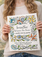 Mindfulnice Breathe Between The Lines coloring book featuring calming line art for mindfulness and relaxation.
