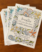 Mindfulnice Breathe Between The Lines coloring book cover featuring calming line art for mindful coloring.