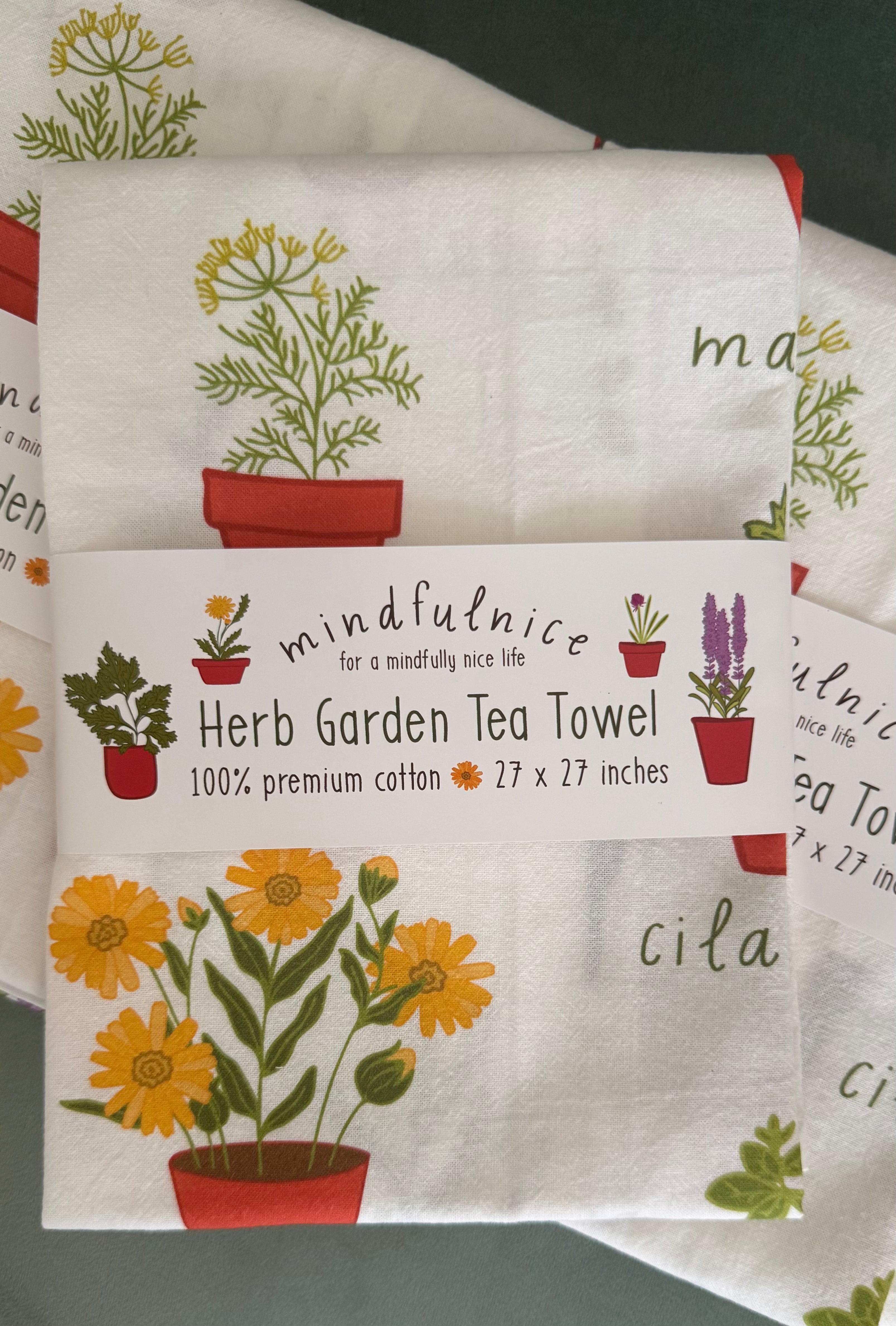 Herb Garden Tea Towel by Mindfulnice featuring a botanical herb print, perfect for kitchen decor and gift-giving.