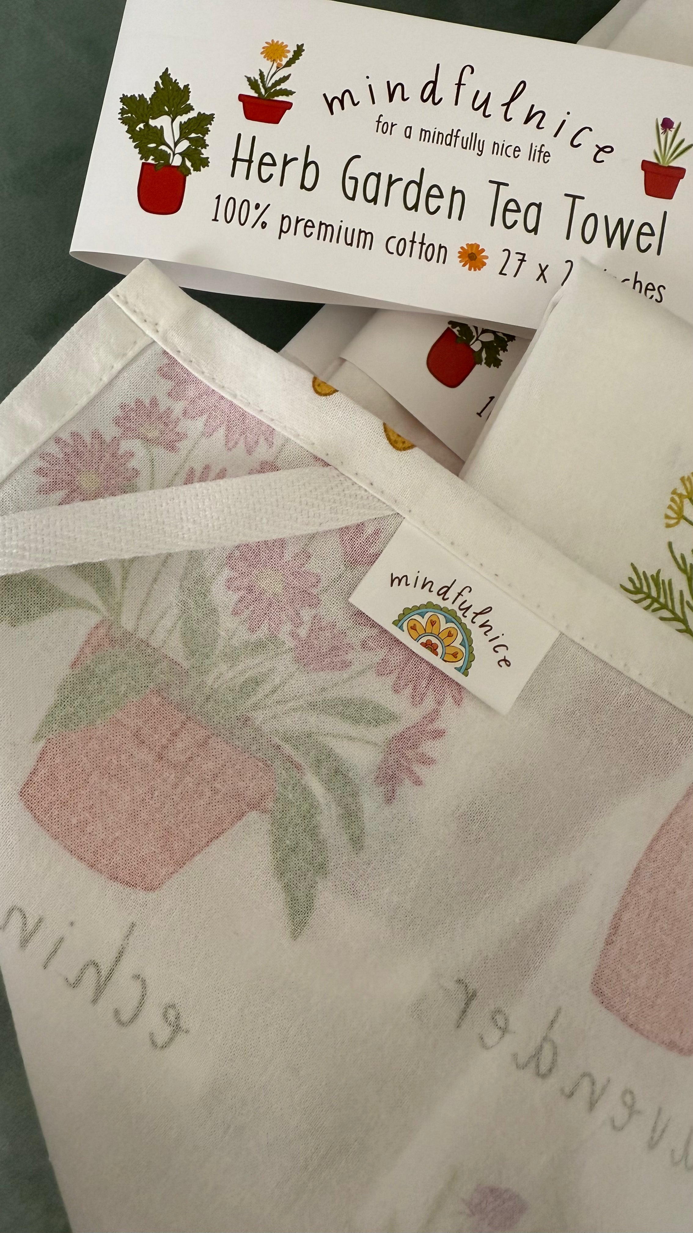 Herb Garden Tea Towel by Mindfulnice featuring botanical herb illustrations, ideal for kitchen decor or gift use.