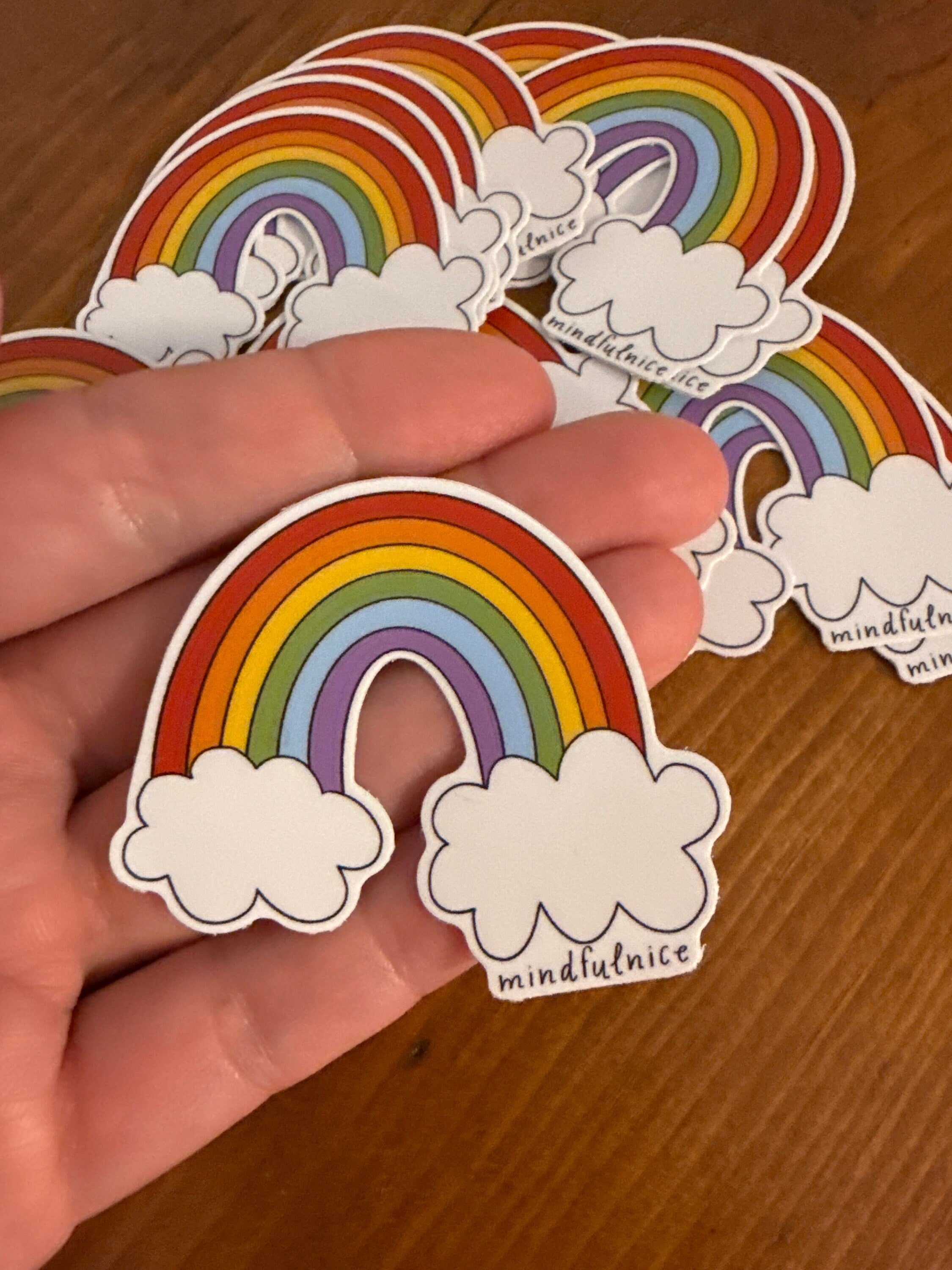 Colorful rainbow sticker by Mindfulnice, featuring vibrant hues and a playful design on a clear background.
