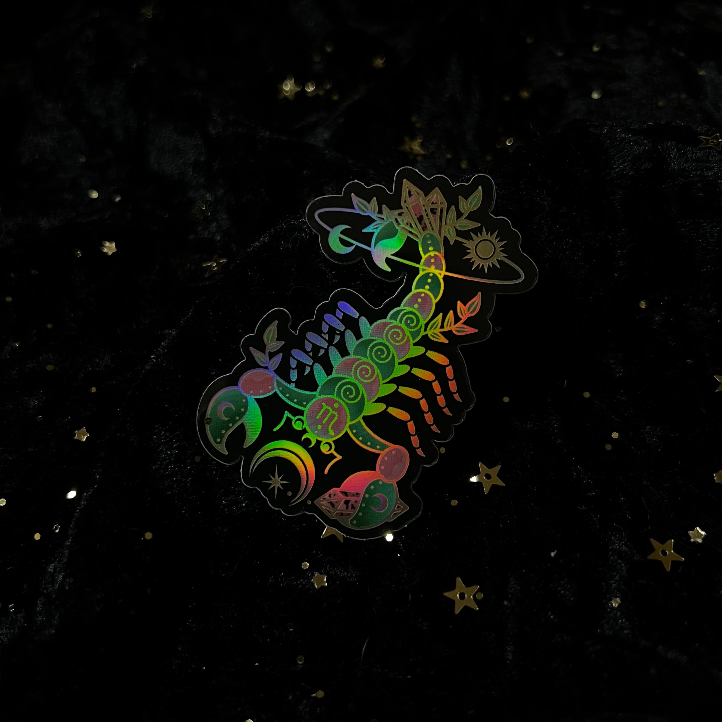 Colorful zodiac crystals sticker by Moonstruck Crystals featuring various zodiac symbols and celestial designs.