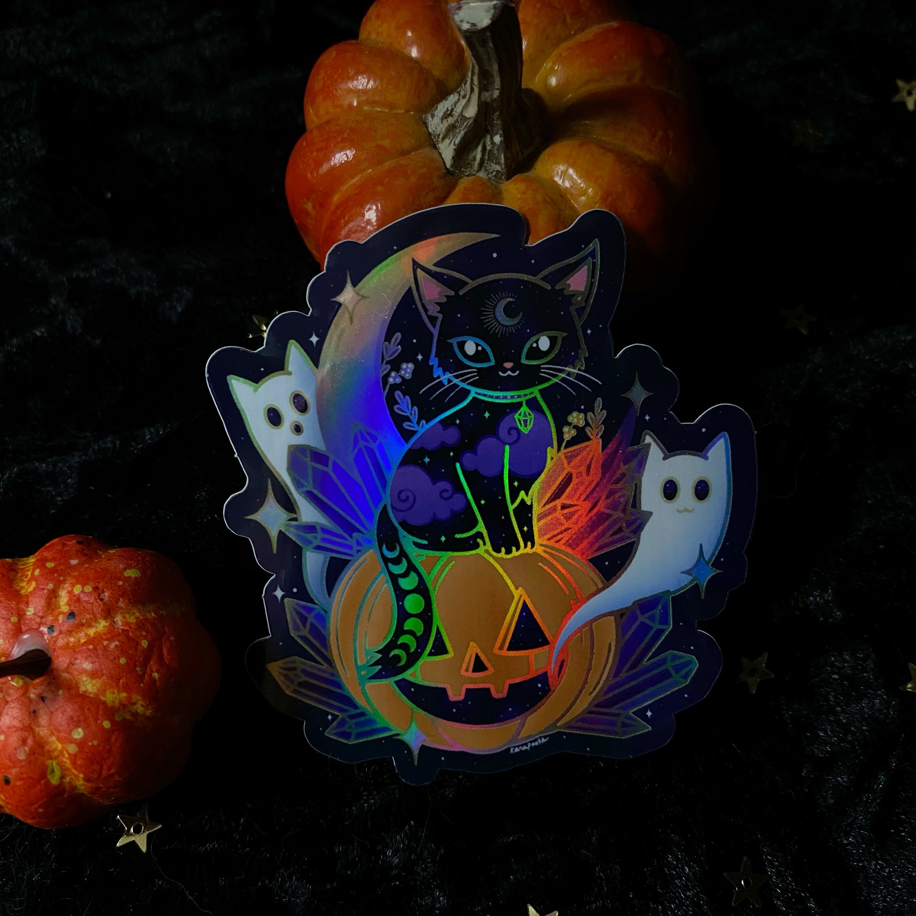 Holo crystal Halloween cat sticker from Moonstruck Crystals featuring a shimmering holographic design with spooky feline details.