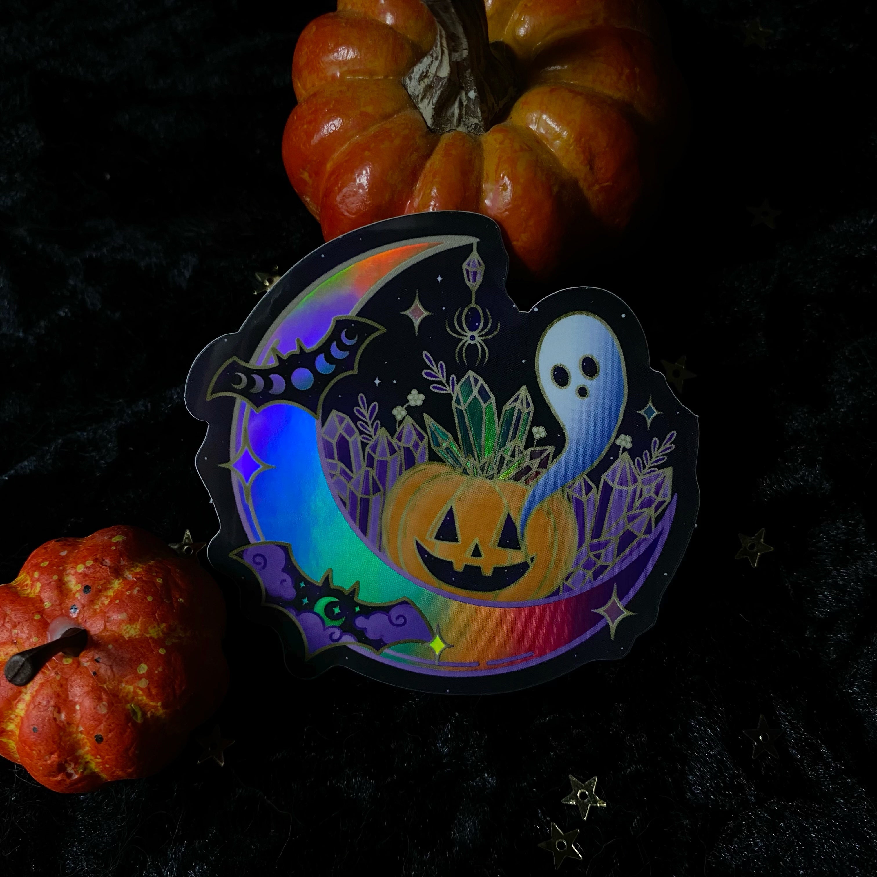 Holo crystal Halloween sticker by Moonstruck Crystals featuring iridescent, holographic Halloween-themed design with shimmering details.