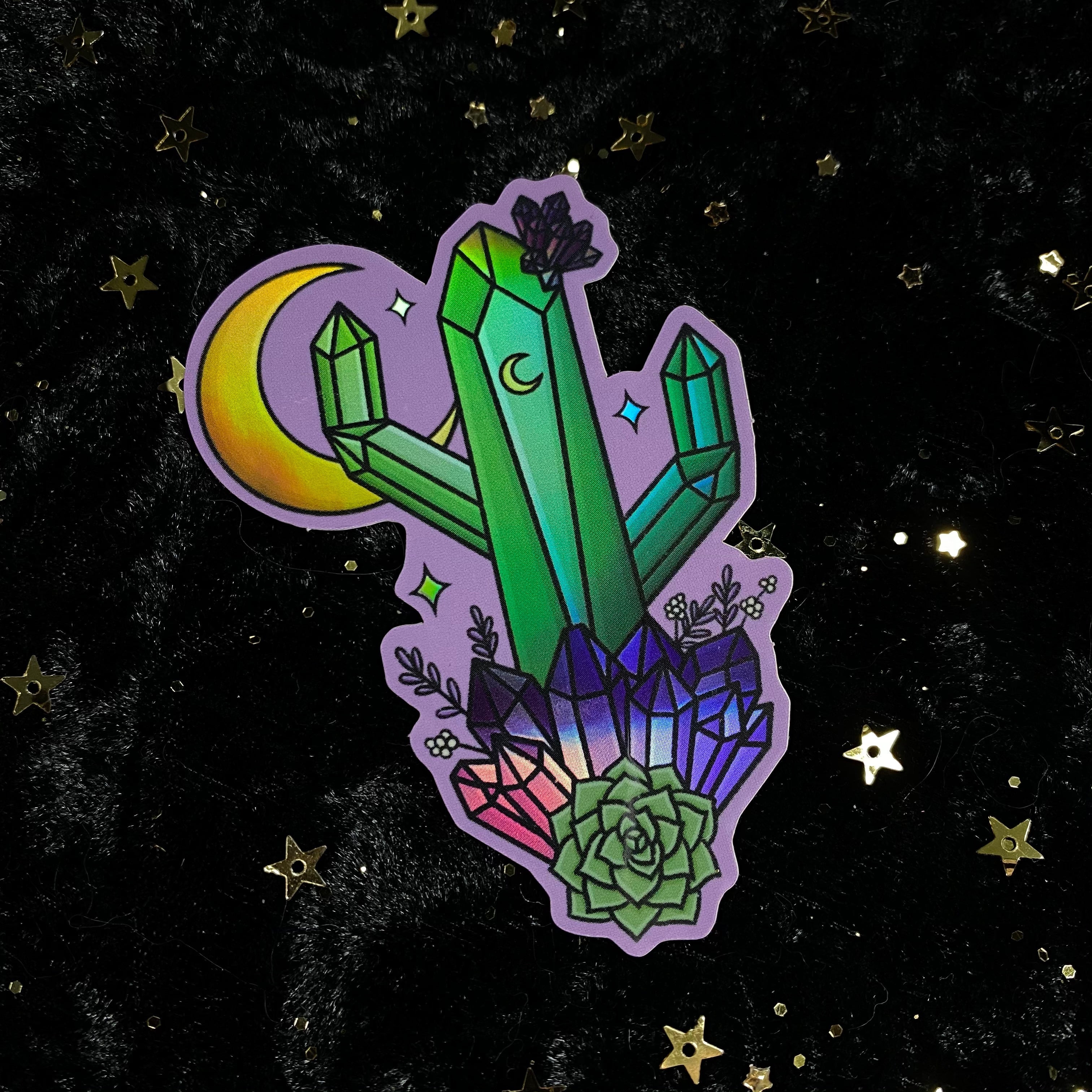 Holographic crystal cactus sticker featuring a shimmering, iridescent cactus design by Moonstruck Crystals for decoration or crafting.