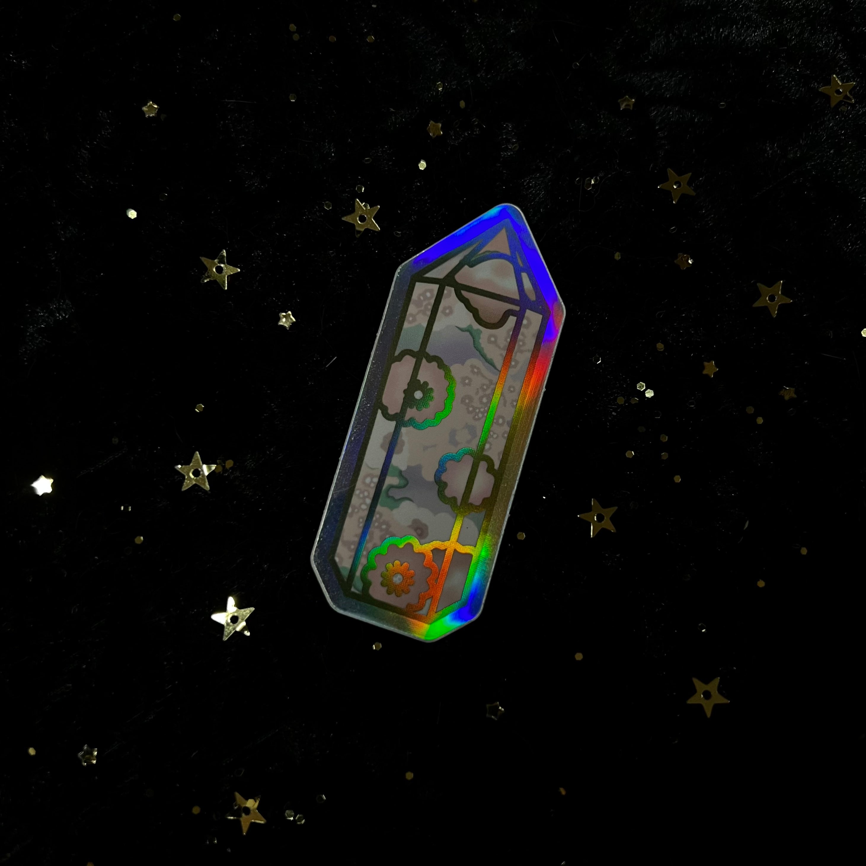 Holo crystal sticker by Moonstruck Crystals featuring iridescent, holographic design and sparkling crystal accents.