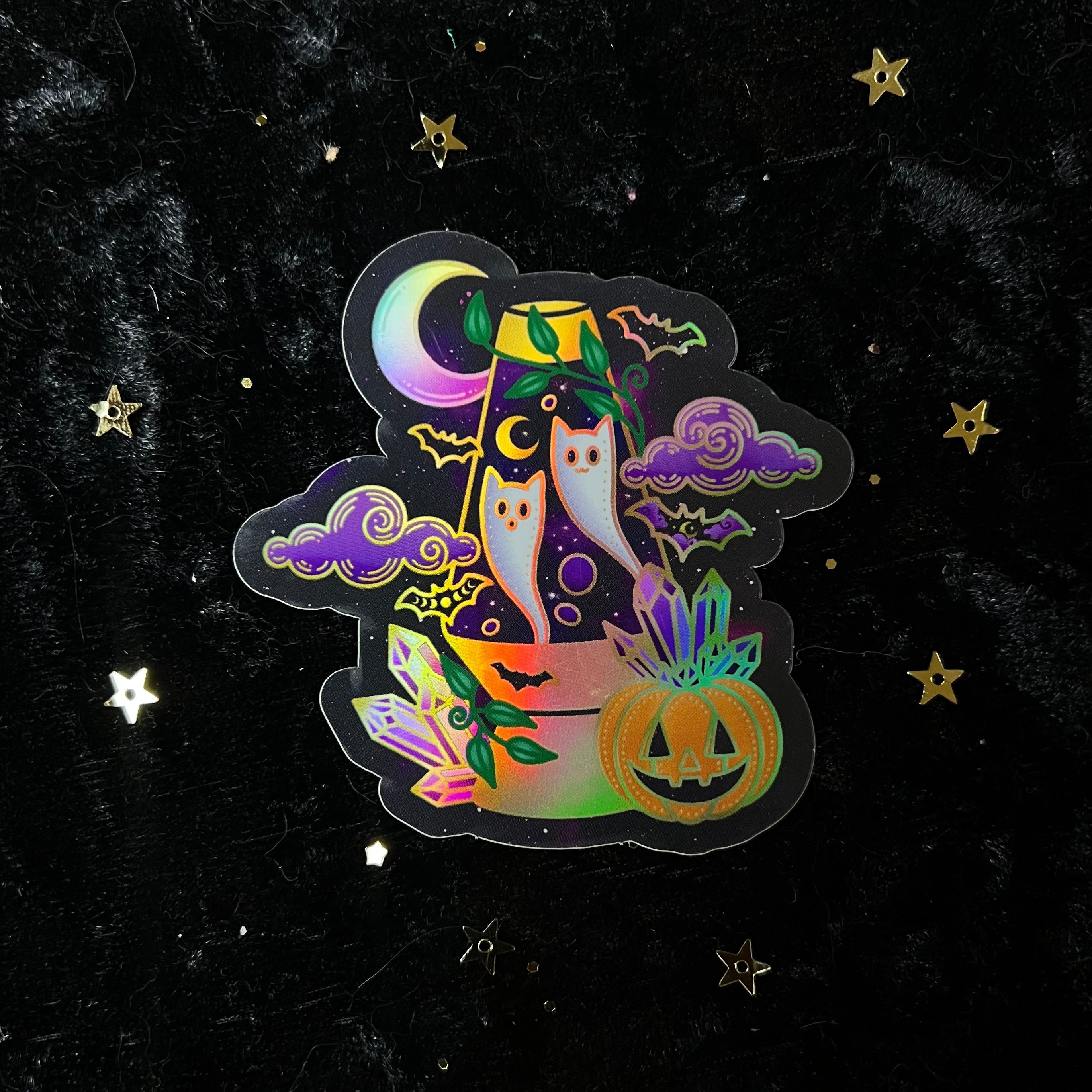 Halloween Crystal Holo Stickers by Moonstruck Crystals featuring colorful, holographic designs perfect for decorating or crafts.