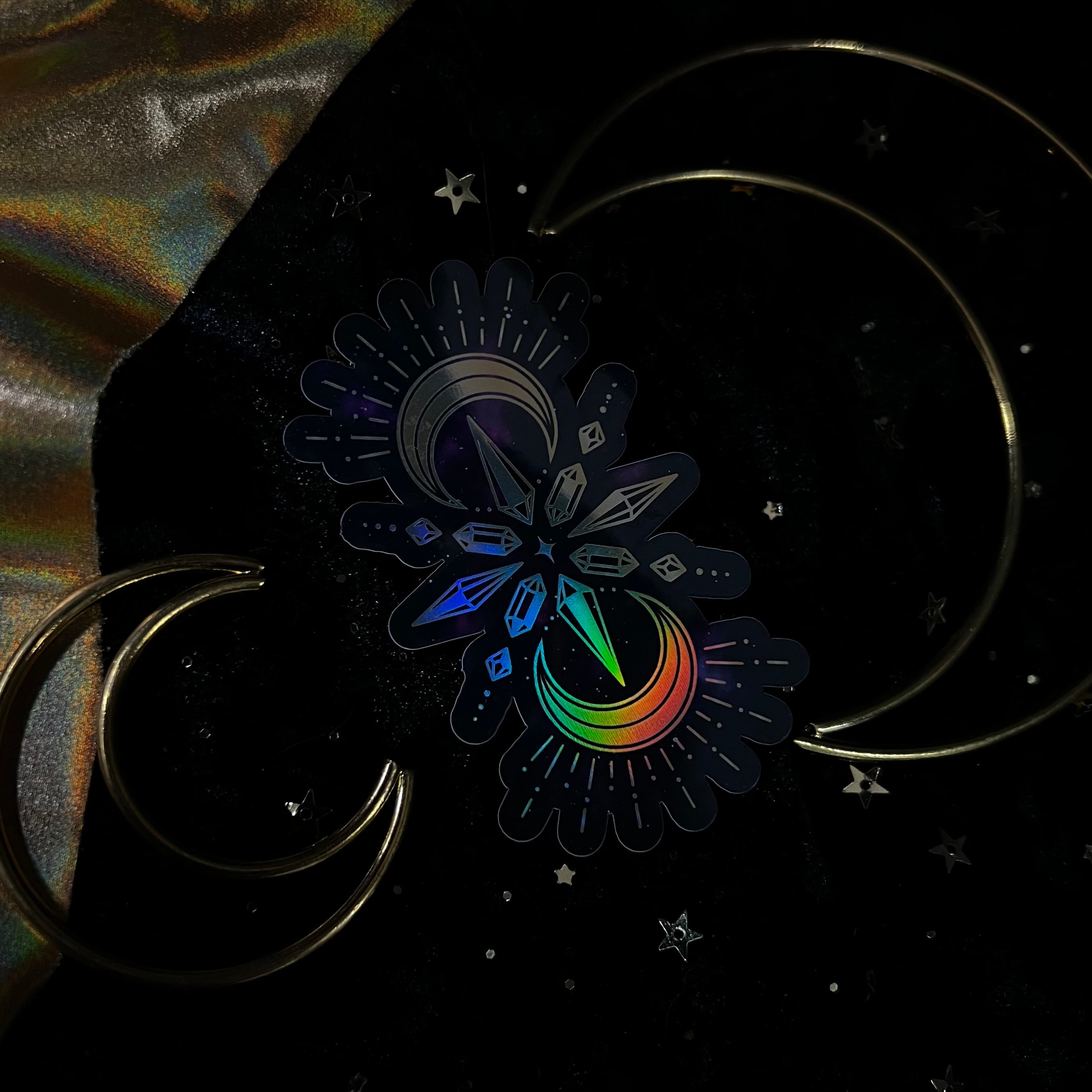 Colorful Crystalstruck Tarot holo stickers by Moonstruck Crystals, featuring vibrant, reflective designs on a clear backing.