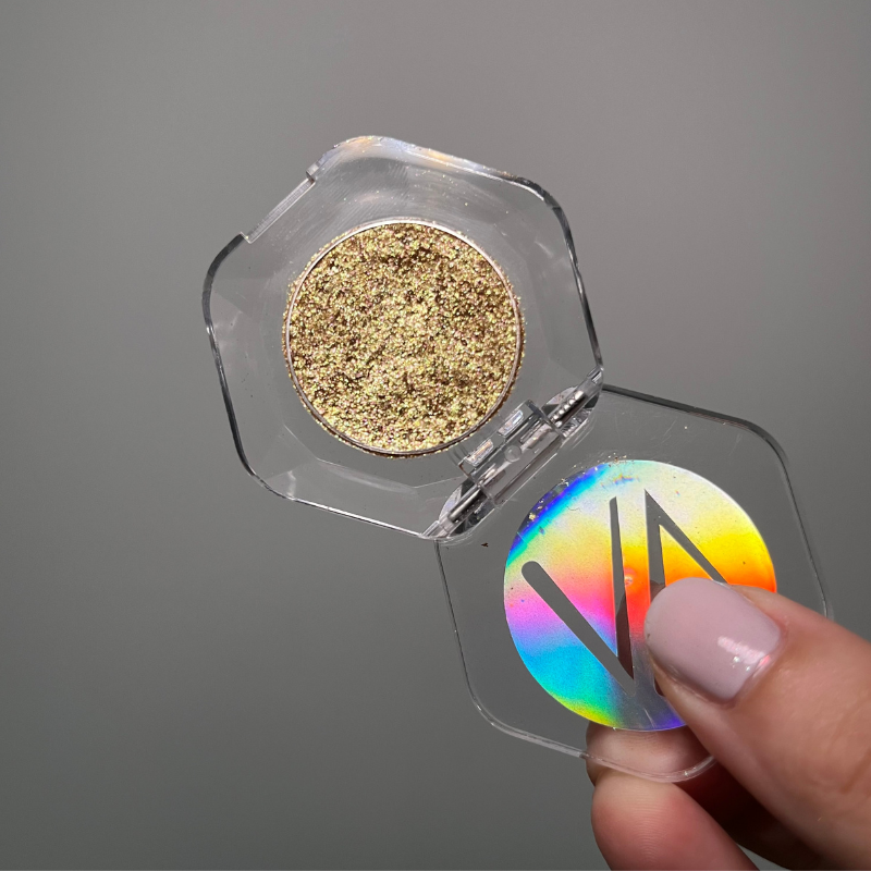 Cream pigment in Galactica shade by NABA Cosmetics USA, showcasing a vibrant, shimmering cosmetic product in a sleek container.
