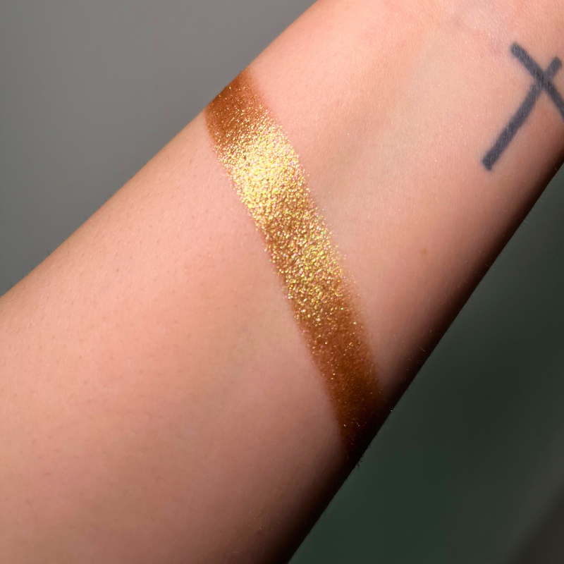 Cream pigment in Galactica shade by NABA Cosmetics USA, showing vibrant, shimmering cream color in a sleek container.