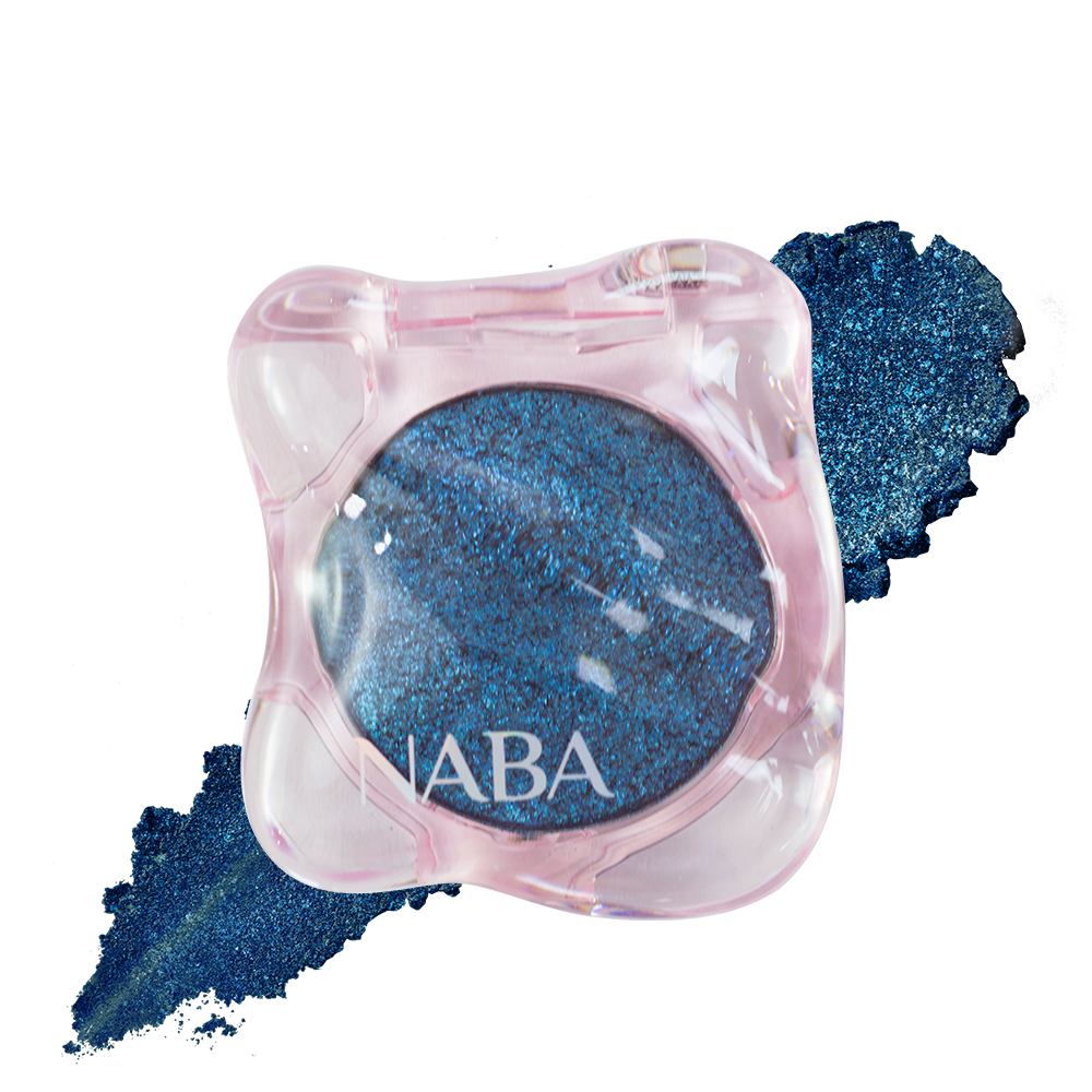 Creamy Pigment Blue Drift by NABA Cosmetics USA, close-up of vibrant blue pigment in a compact container.