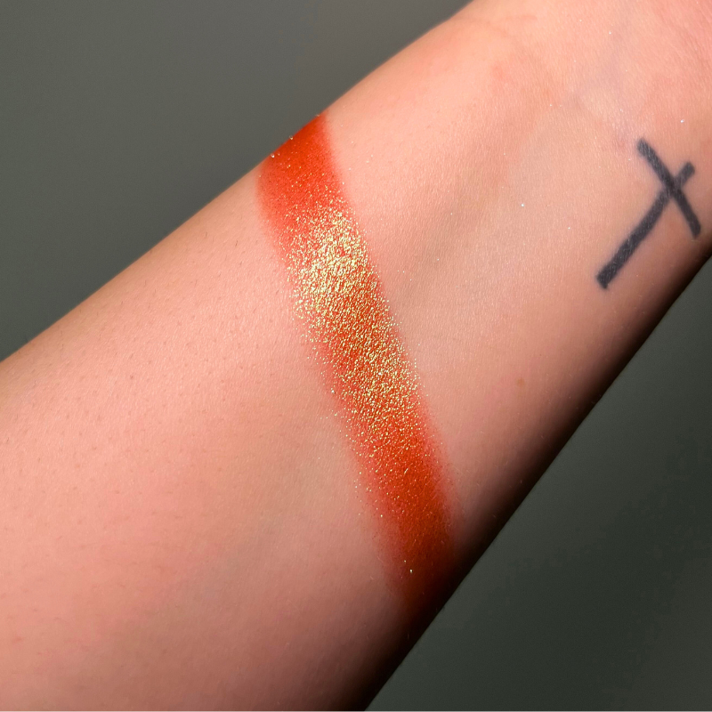 Creamy Pigment Lily by NABA Cosmetics USA, vibrant pink eyeshadow swatch in a close-up image.