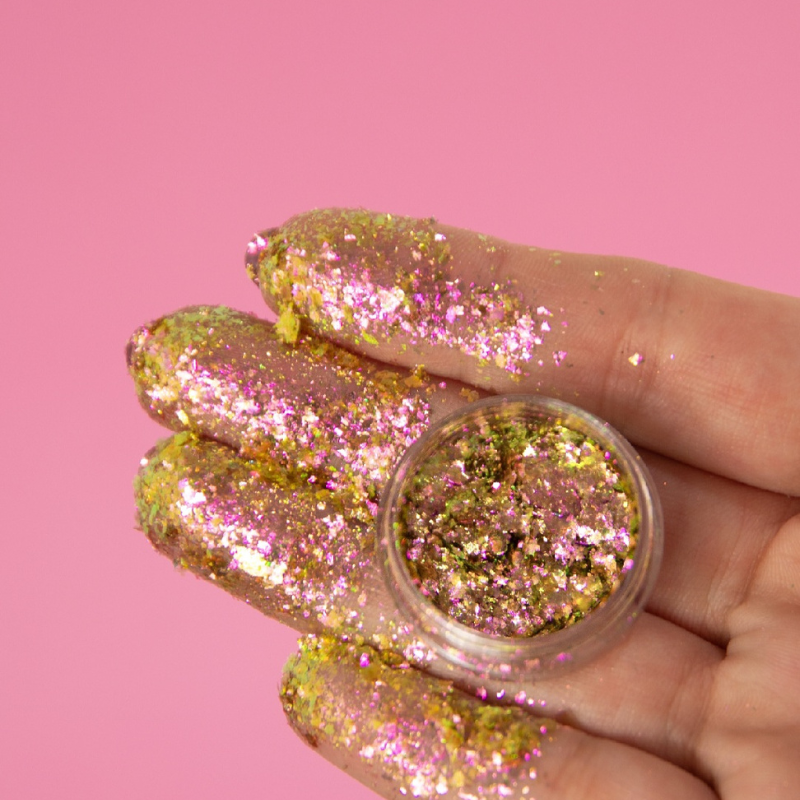 NABA Cosmetics USA Flake Campanita with colorful, shiny flakes in a compact container, showcasing vibrant cosmetic embellishments.