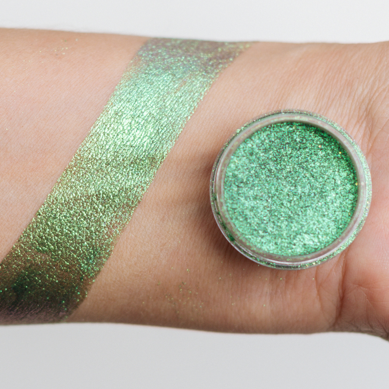 NABA Cosmetics USA Jade Pigment in a small jar with vibrant green powder, showcasing its rich, shimmering jade color.