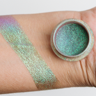 Bright Magic Pigment by NABA Cosmetics USA showing shimmering, colorful powder in a sleek container.