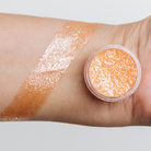 NABA Cosmetics USA Miracle Pigment in vibrant, shimmering color, shown in a close-up image with a smooth, reflective surface.